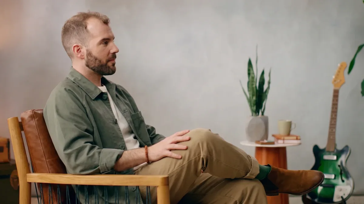 Matthew Karsten in profile, seated in the studio chair.
